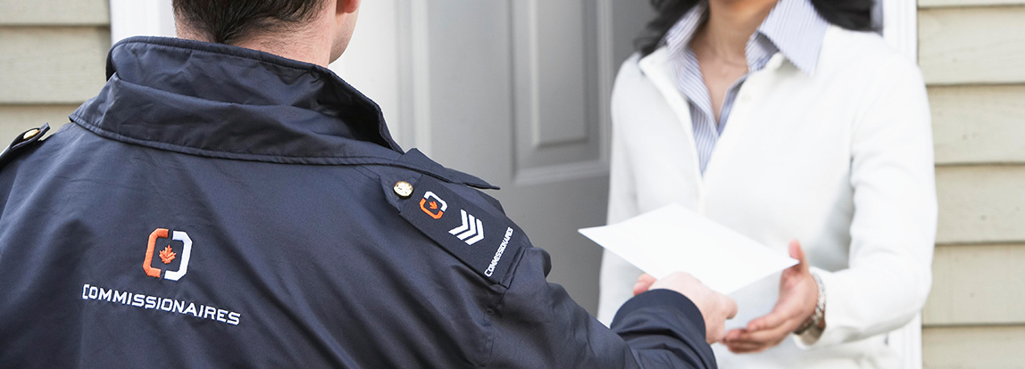 An officer serving a document to an individual