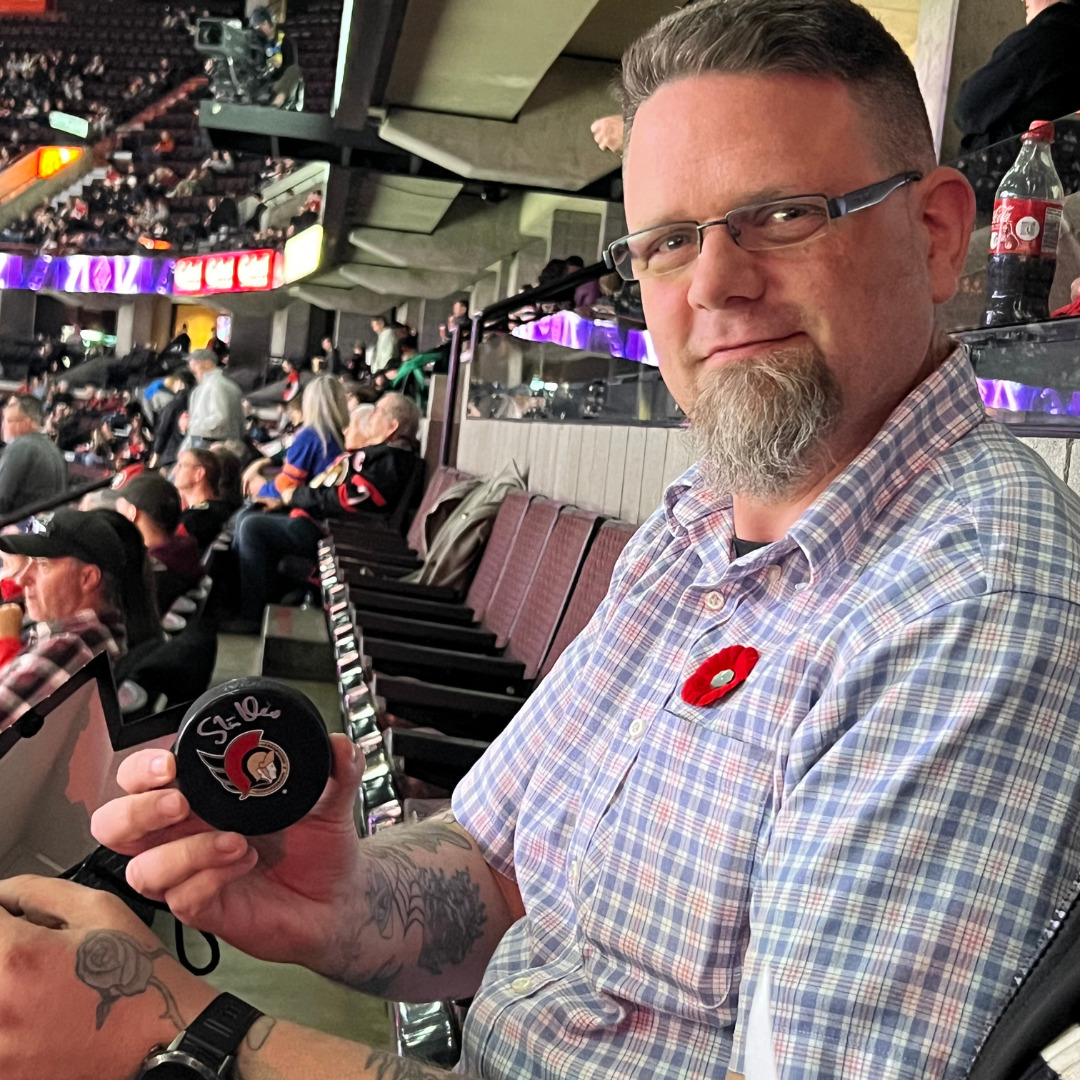 Commissionaire John O’Connor enjoying an Ottawa Senators game.  