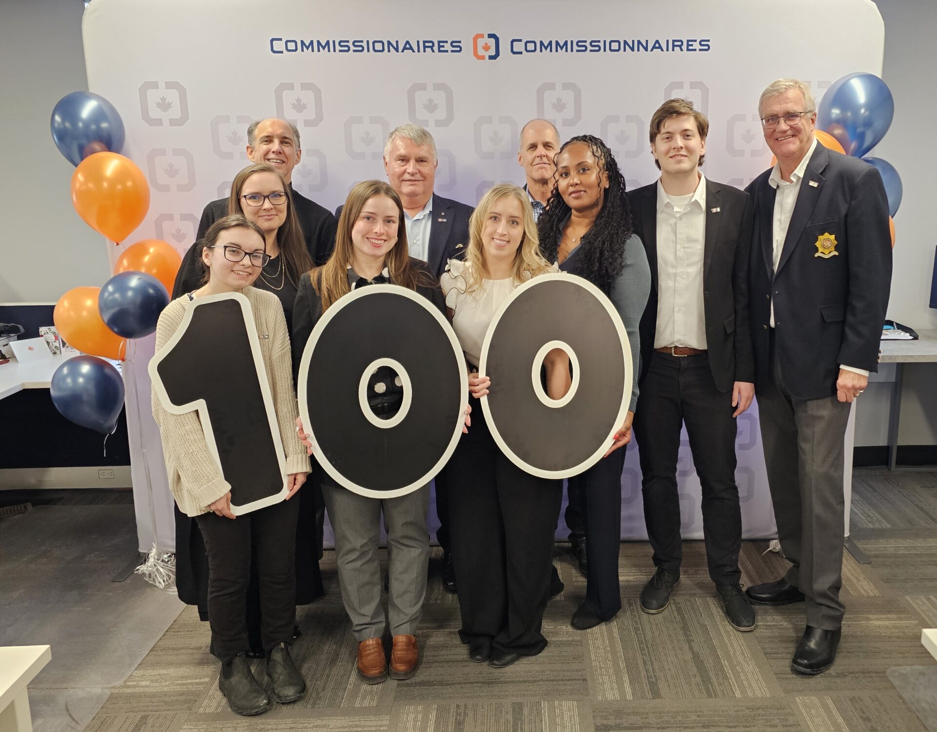 Commissionaires National Office Staff celebrating the beginning of the Centennial year.