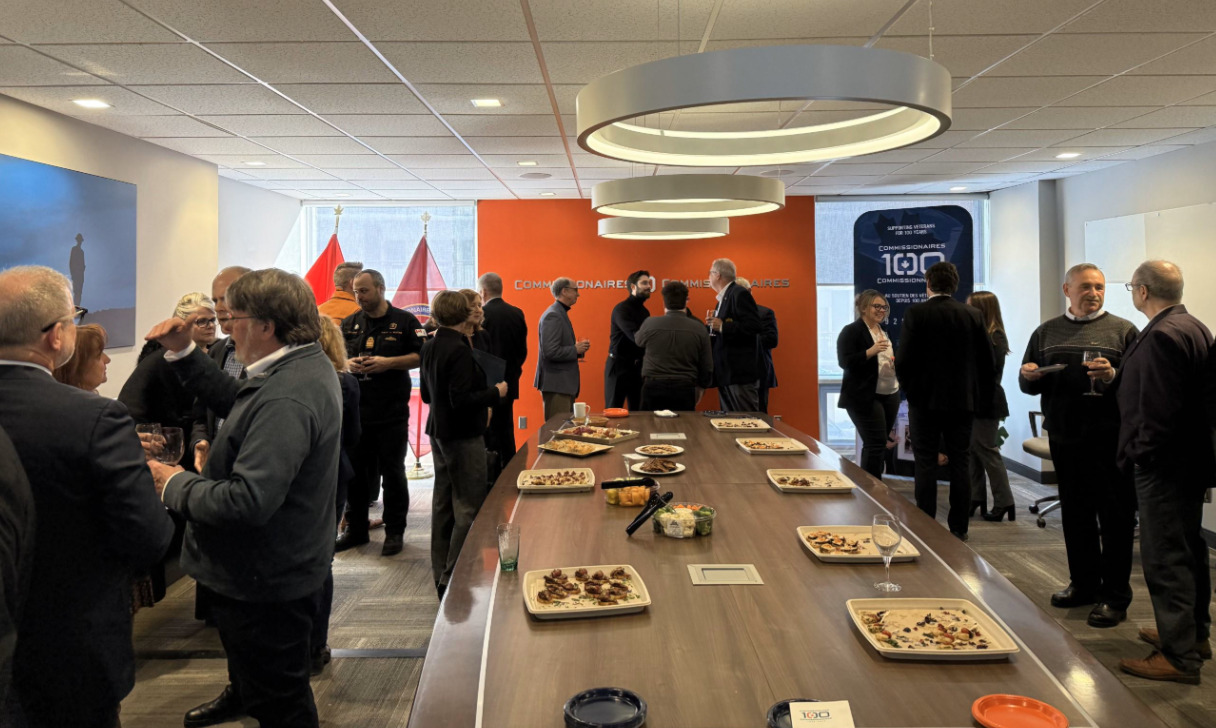 Guests conversing at the Centennial Reception.