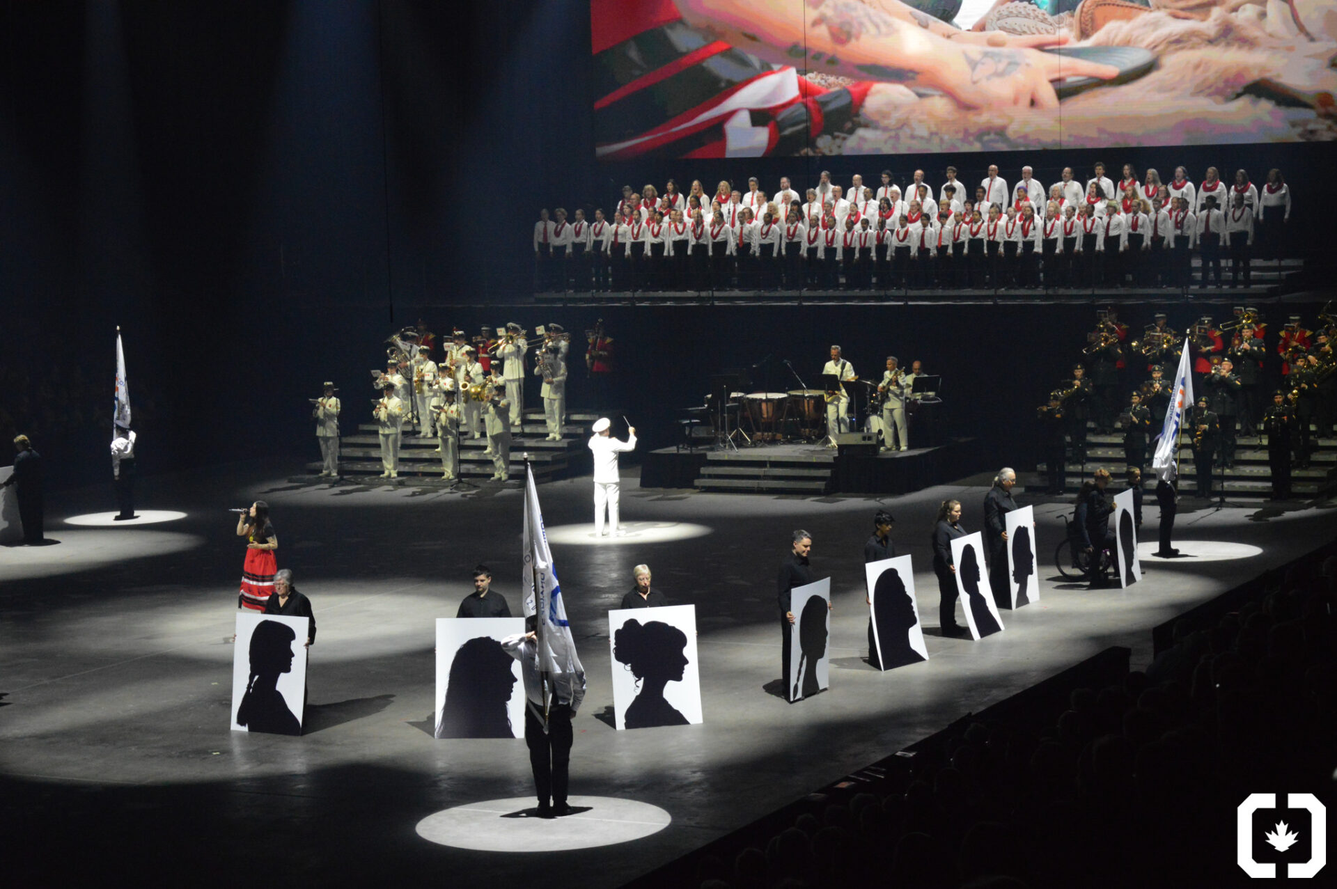 Commissionaires Nova Scotia and Emma Stevens perform on stage at the Royal Nova Scotia Tattoo